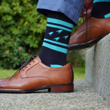 Load image into Gallery viewer, Inspired by the classic rugby sock, the birdland rebel is worldly while paying homage to its hometown roots. Dark navy with bright blue highlights and a simple red contrasting finch, your style choice will not go unnoticed. Add finish to both formal and casual outfits and win the day.
